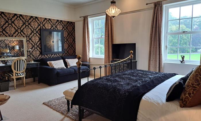 The luxurious Copper Beech Suite at Glangwili Mansion Luxury Bed & Breakfast featuring a superking size bed and a very comfortable memory foam sofabed